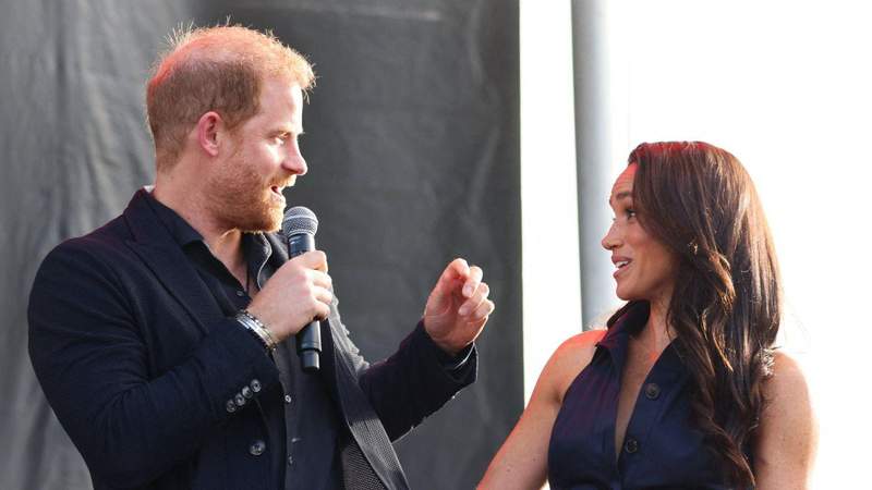 Prince Harry remained seated while Meghan Markle danced at their table to Adam Levine. MEGA