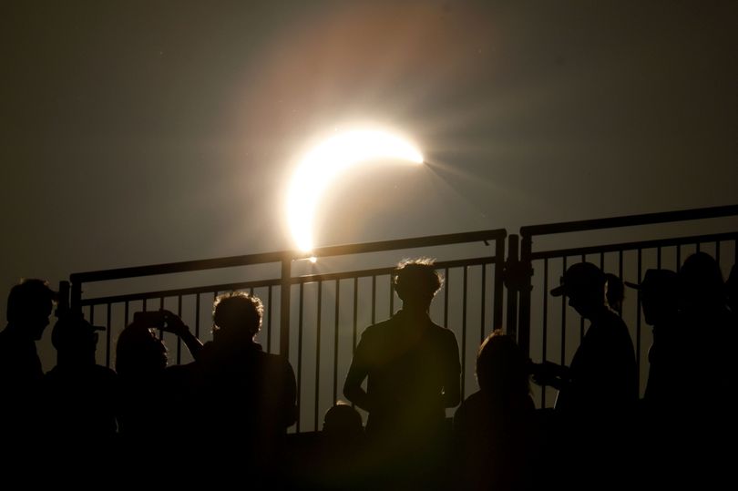 Solar eclipse watchers rejoice as Moon slides in front of Sun for once-in-a-lifetime celestial display