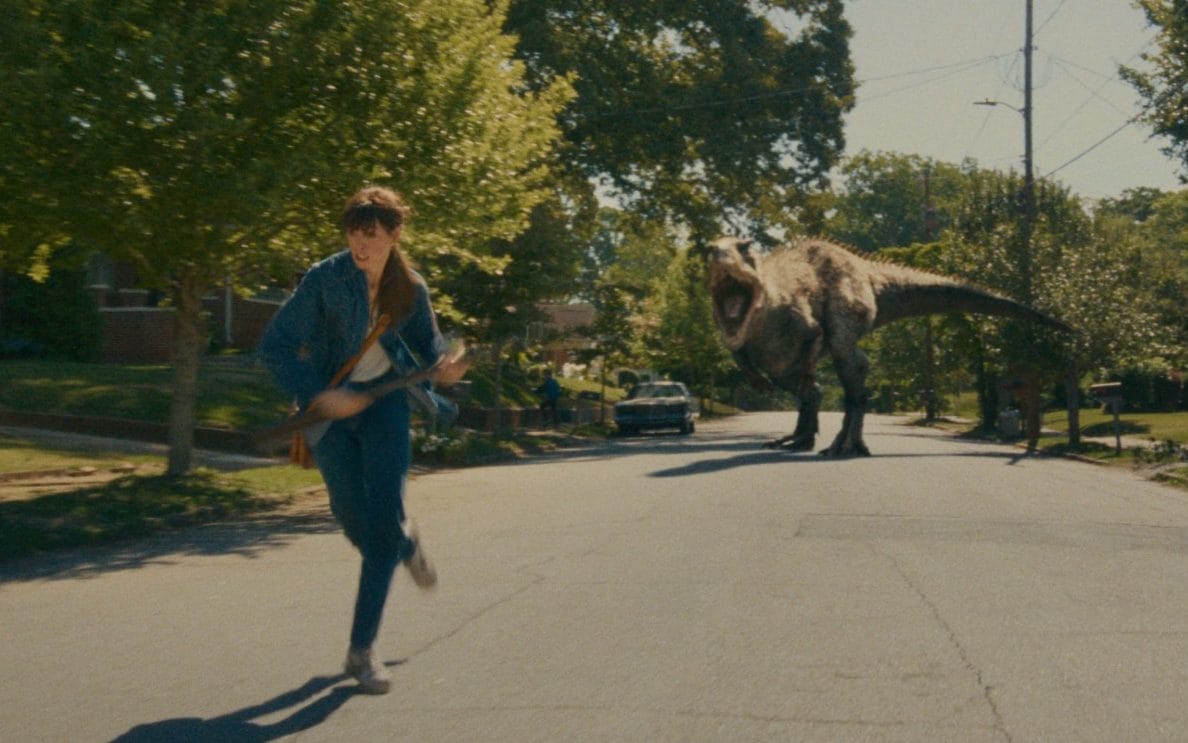 Watching Anne Hathaway get chased by dinosaurs is enormous fun