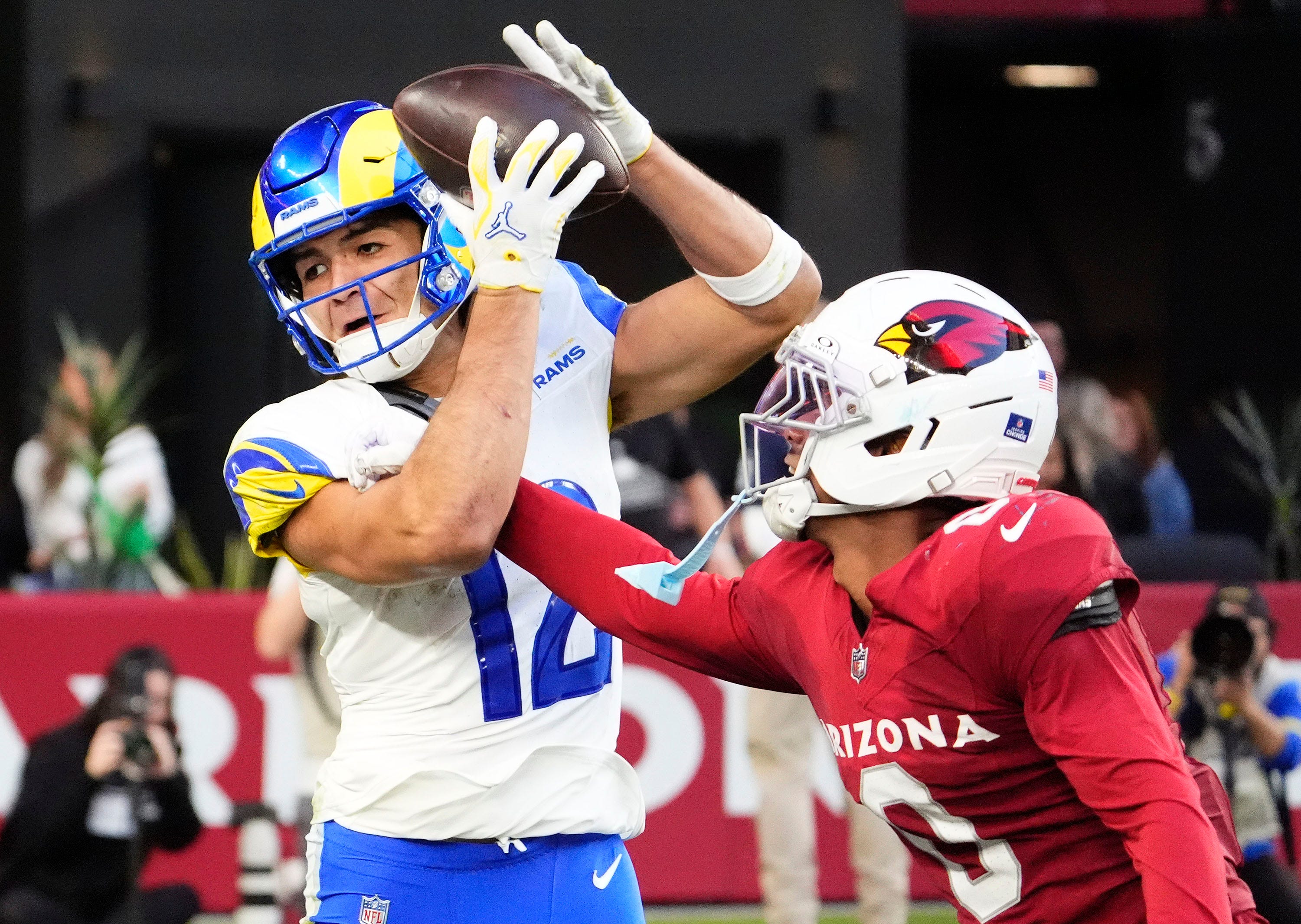 Cardinals rival WR injured with glass-door run in