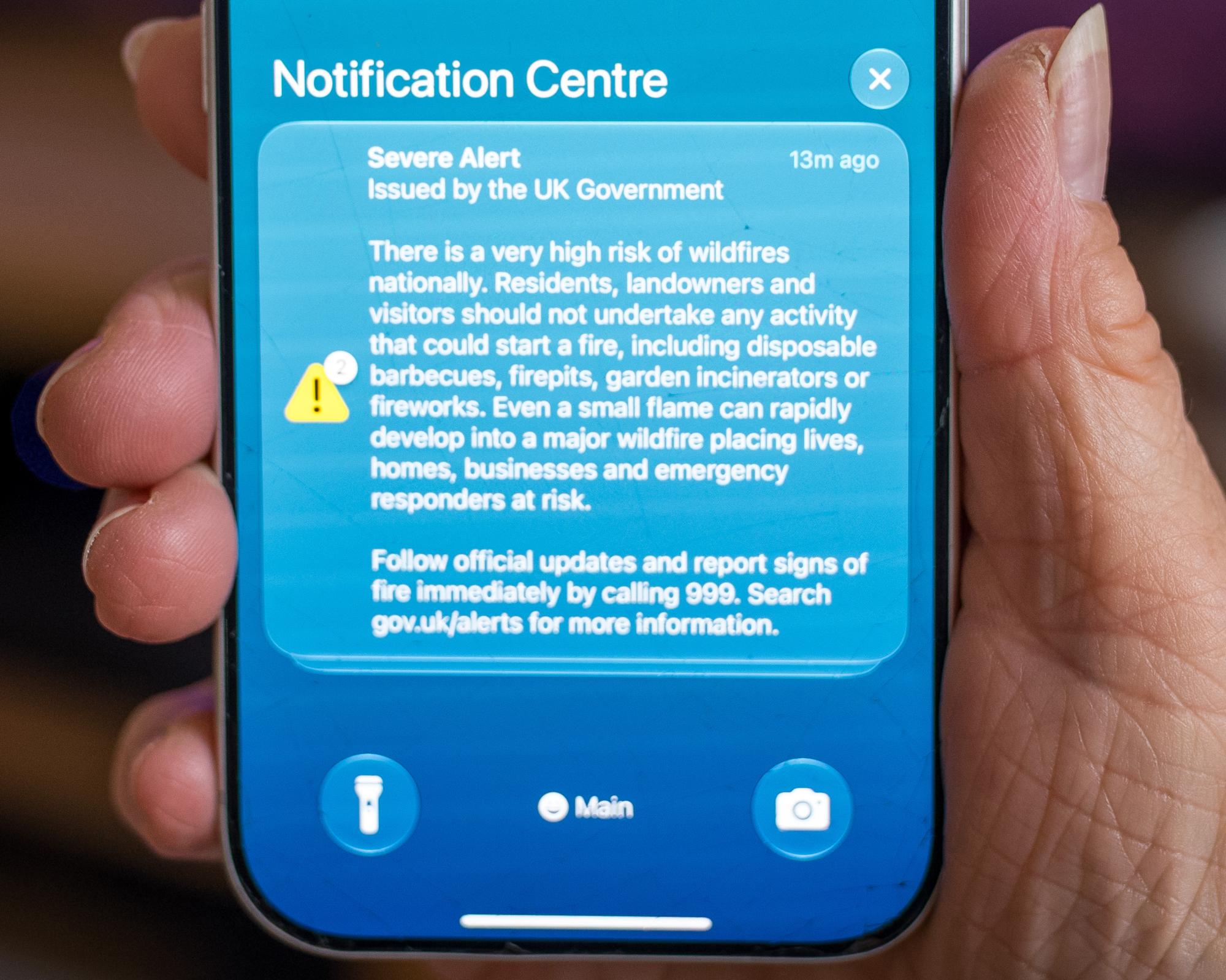 Alarmed by the alarm: people react to ‘severe alert' on phones with message on UK wildfires