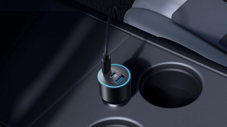 The Anker Nano Car Charger (167.5W, 3 Ports) plugged into a car