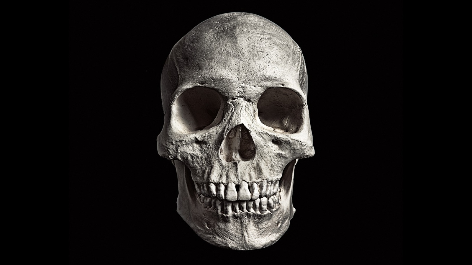 The Bizarre Phenomenon That Can Happen To Human Teeth After Death