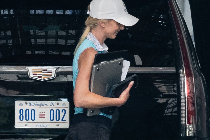 Loyal aide Natalie Harp seen carrying 2 laptops and 3 phones on golf getaway with Trump; Melania absent as social media notes her constant presence