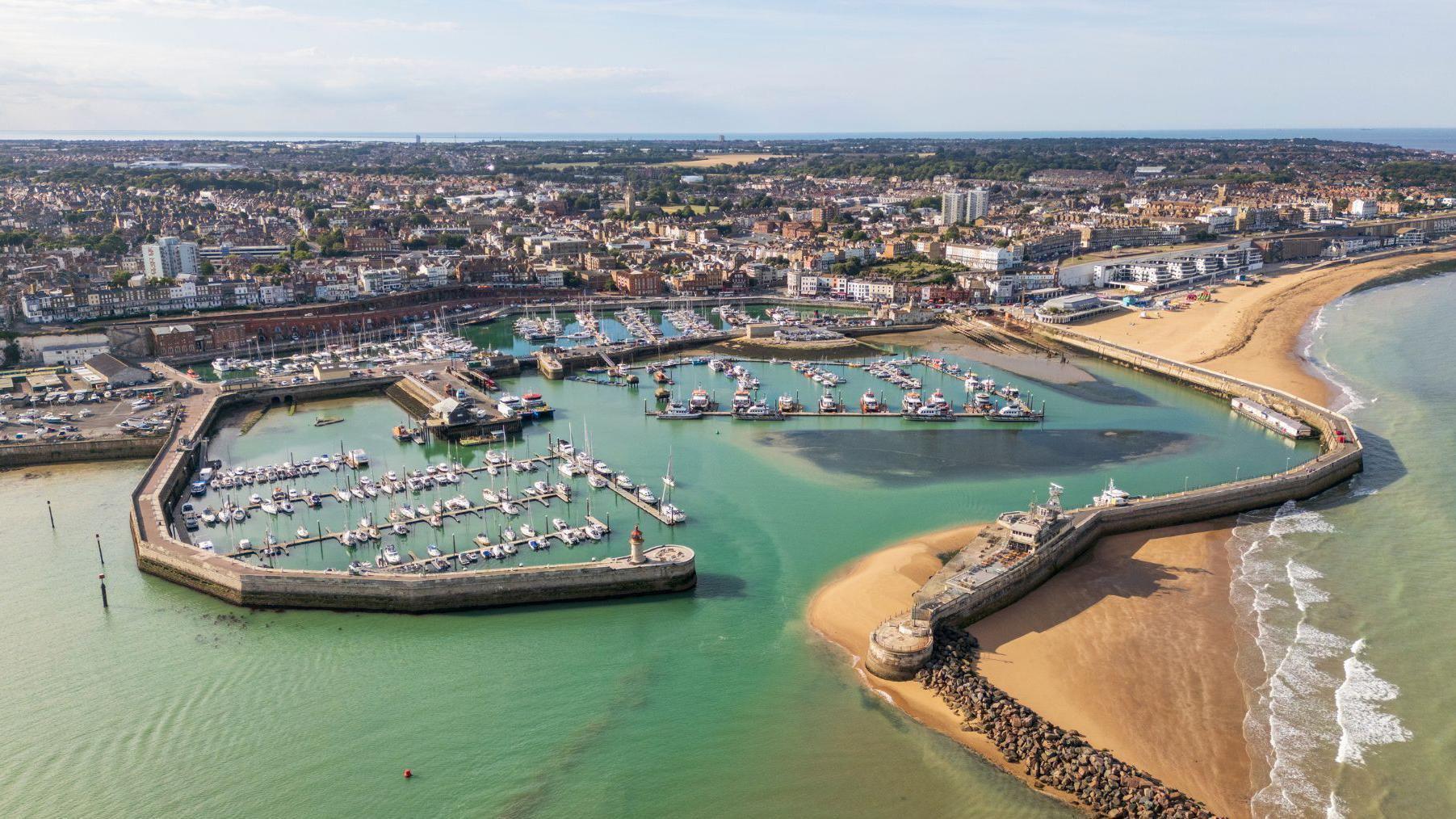 Arrest after two men stabbed at popular waterfront