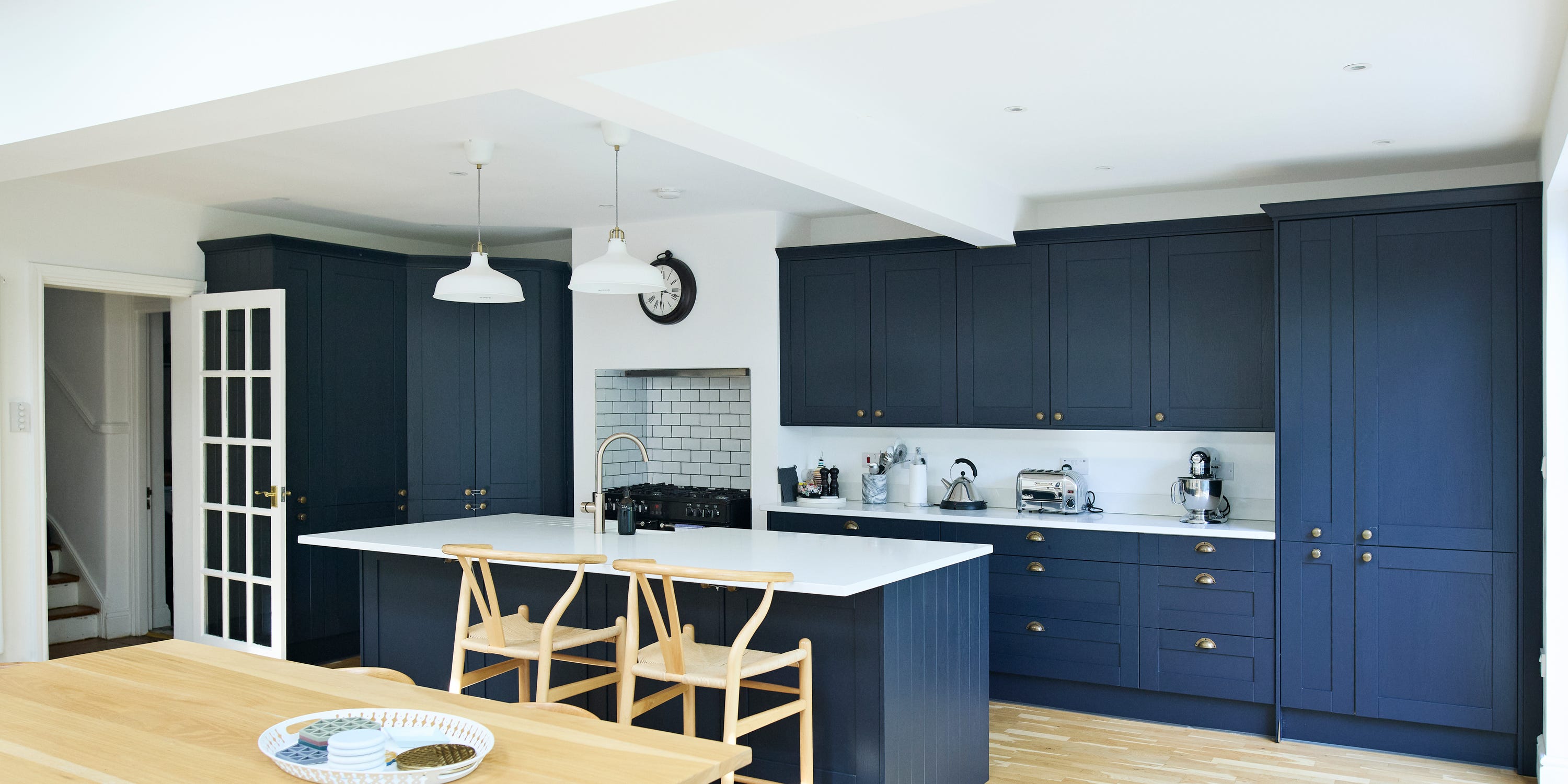 Designers Say Blue Kitchen Cabinets Are Trending—Here's How to Style Them