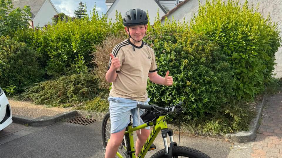 Boy takes on 30-day triathlon in stepdad's memory
