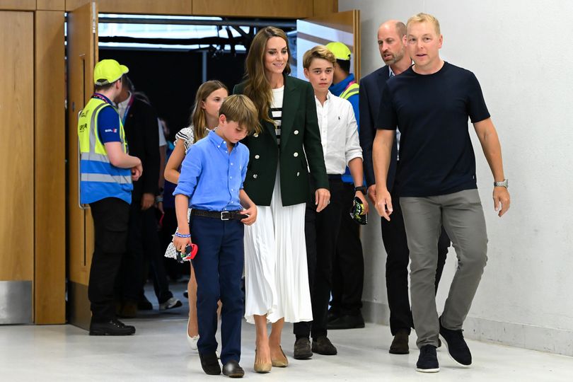 Sir Chris Hoy guides Prince William and Princess Catherine of Wales and their children Prince George, Prince Louis and Princess Charlotte around a building during the Glasgow 2026 Commonwealth Games