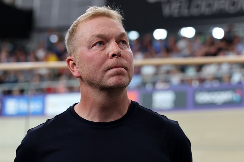 Sir Chris Hoy stands in front of the Sir Chris Hoy Velodrome sign during the Glasgow 2026 Commonwealth Games at Glasgow International Arena