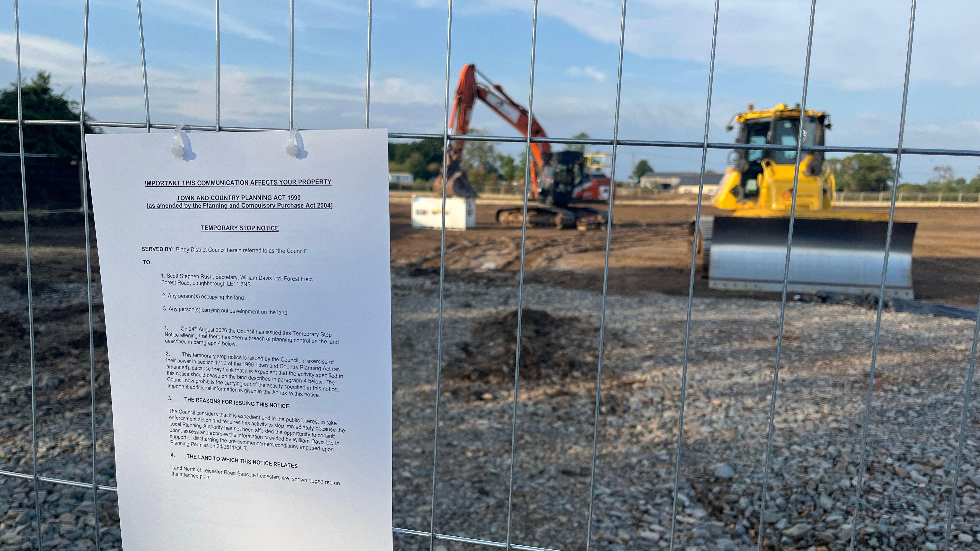 Builders told to halt housing scheme over 'breaches'