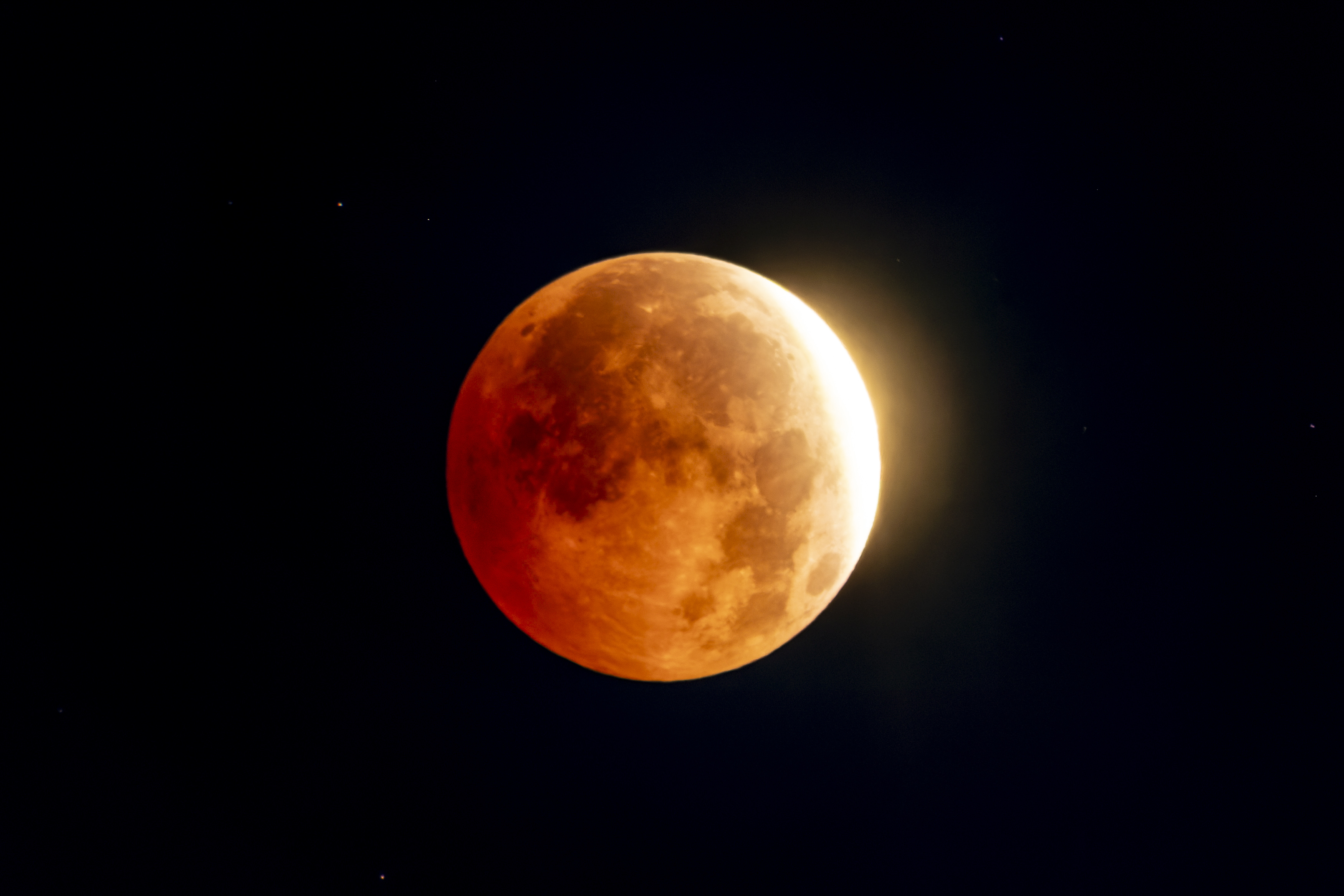 The moon turned a deep red overnight. See the near-total lunar eclipse in 17 breathtaking photos.