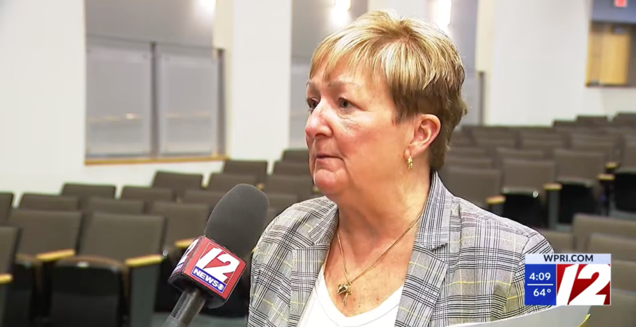 Then-Rhode Island state Representative Julie Casimiro speaks with a WPRI reporter inside the State House.