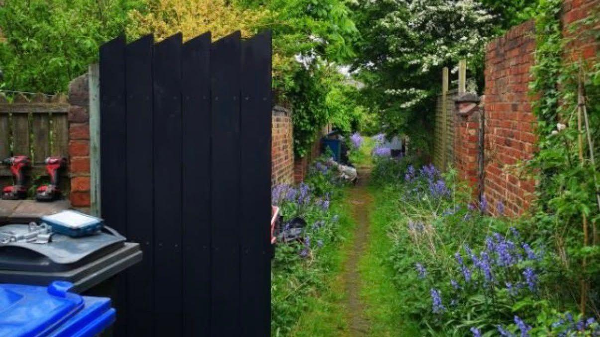 New Photo - Anger as workmen rip out 'lovely' alley garden