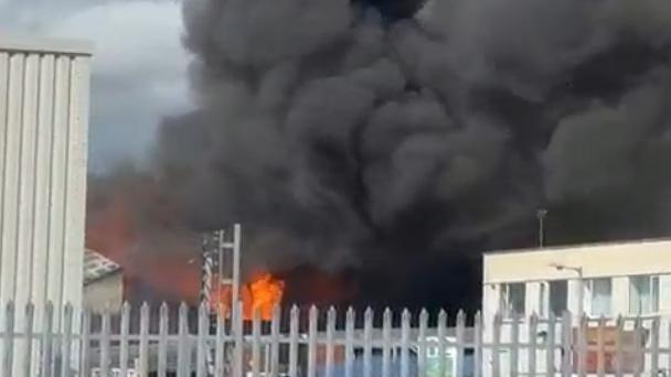 Blasts heard as crews battle industrial unit fire