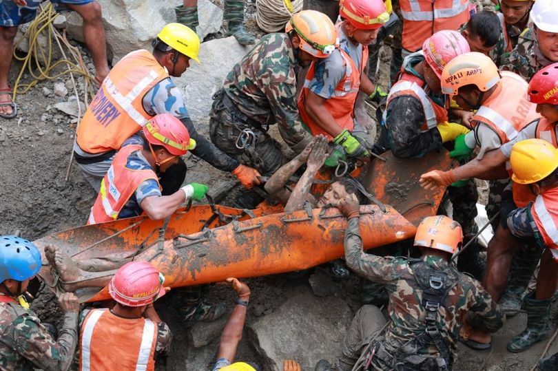 Remarkable moment survivor is rescued from Nepal tunnel nine days after deadly floods