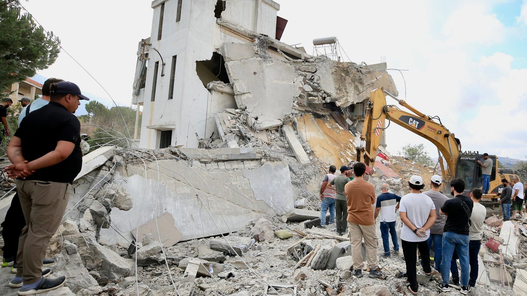 Israeli strikes in southern Lebanese village kill 11, state media say