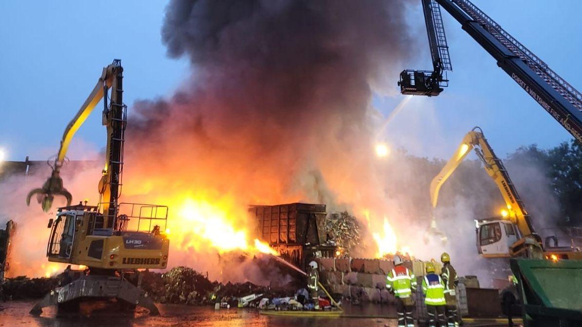 Smoke warning over scrap metal and electrical fire