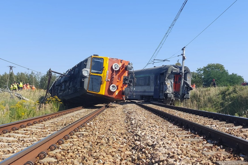 Train derails after crashing into truck in Poland with at least 20 casualties