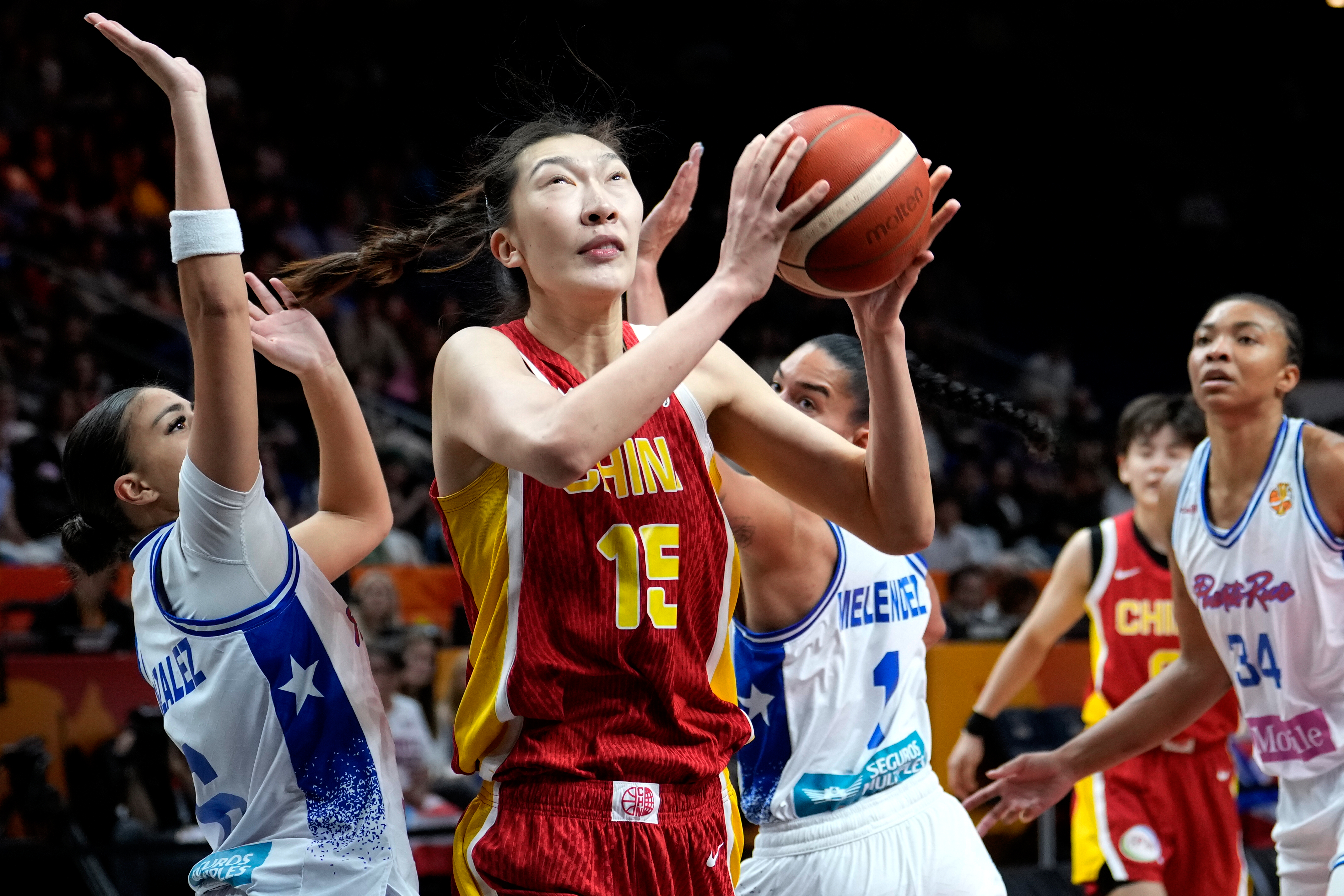 Australia tops Italy after blowing 26-point lead and China edges Puerto Rico to reach quarterfinals