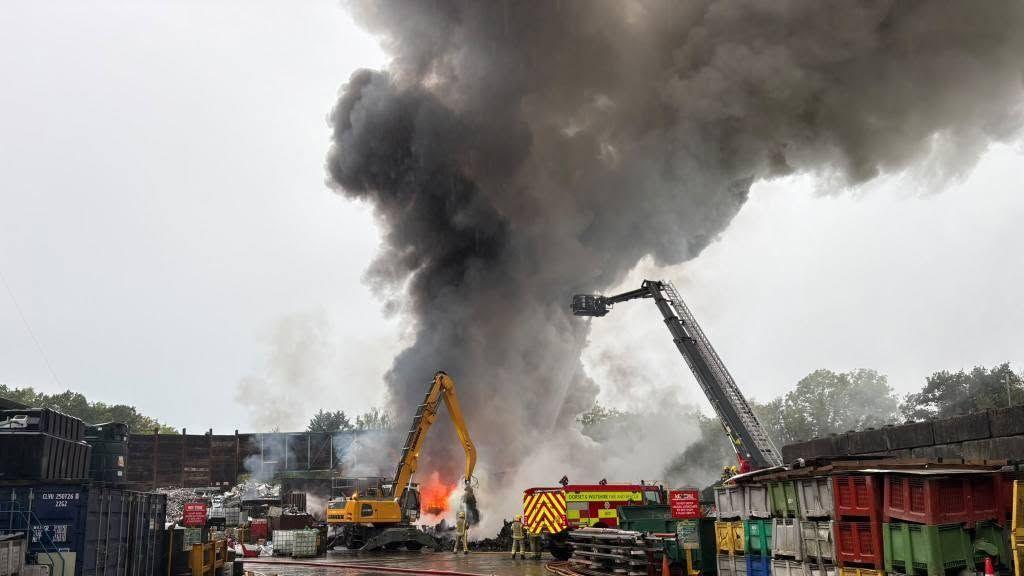 Crews leave scrap fire that sparked huge smoke plume