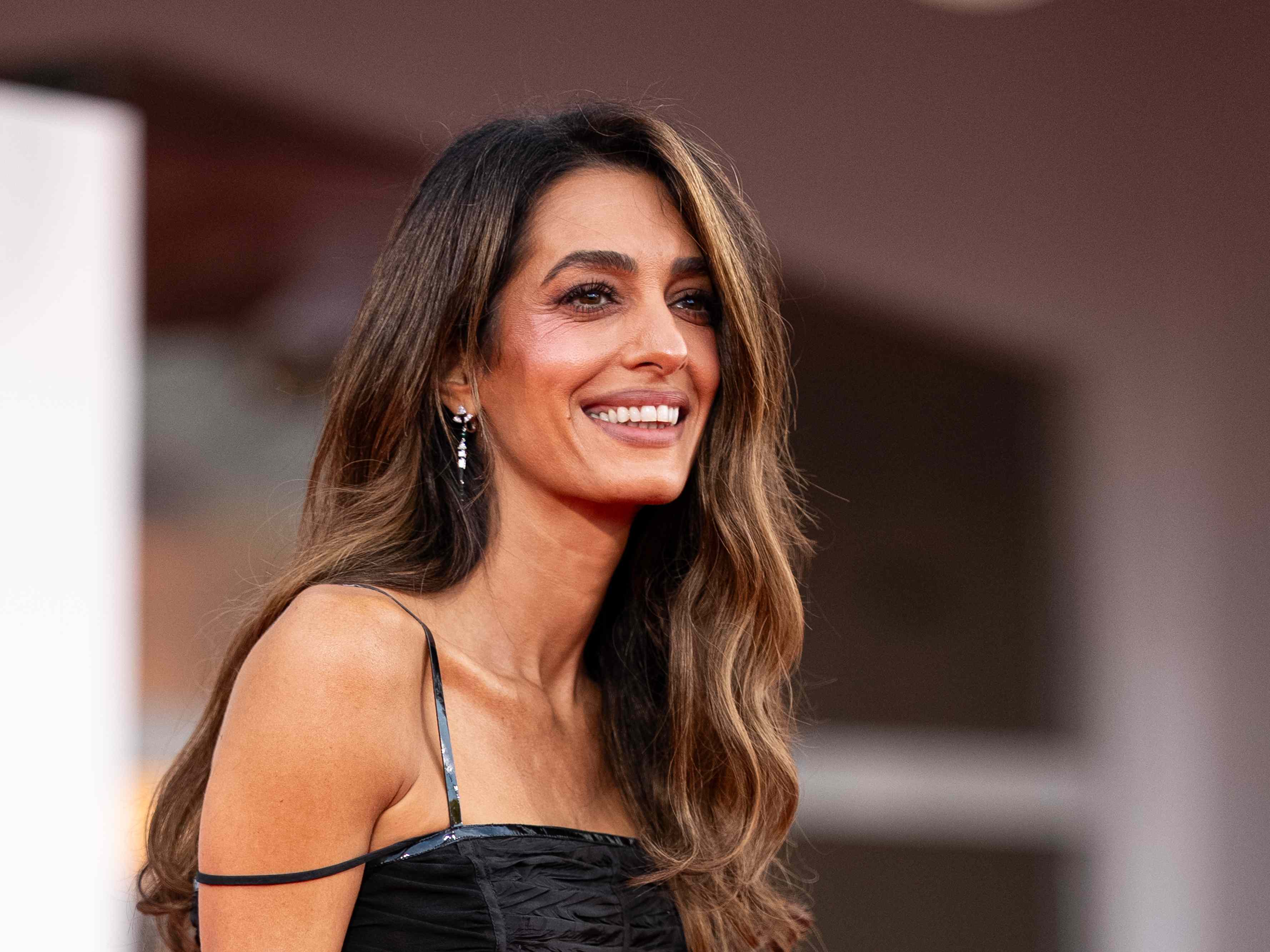 Amal Clooney Rewears a Red-Hot Skirt Suit With Towering Animal Print Stilettos for a Professional Outing