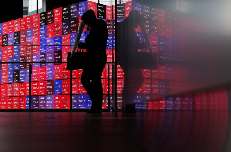 Shares slip in Asia as oil climbs, rate hikes loom