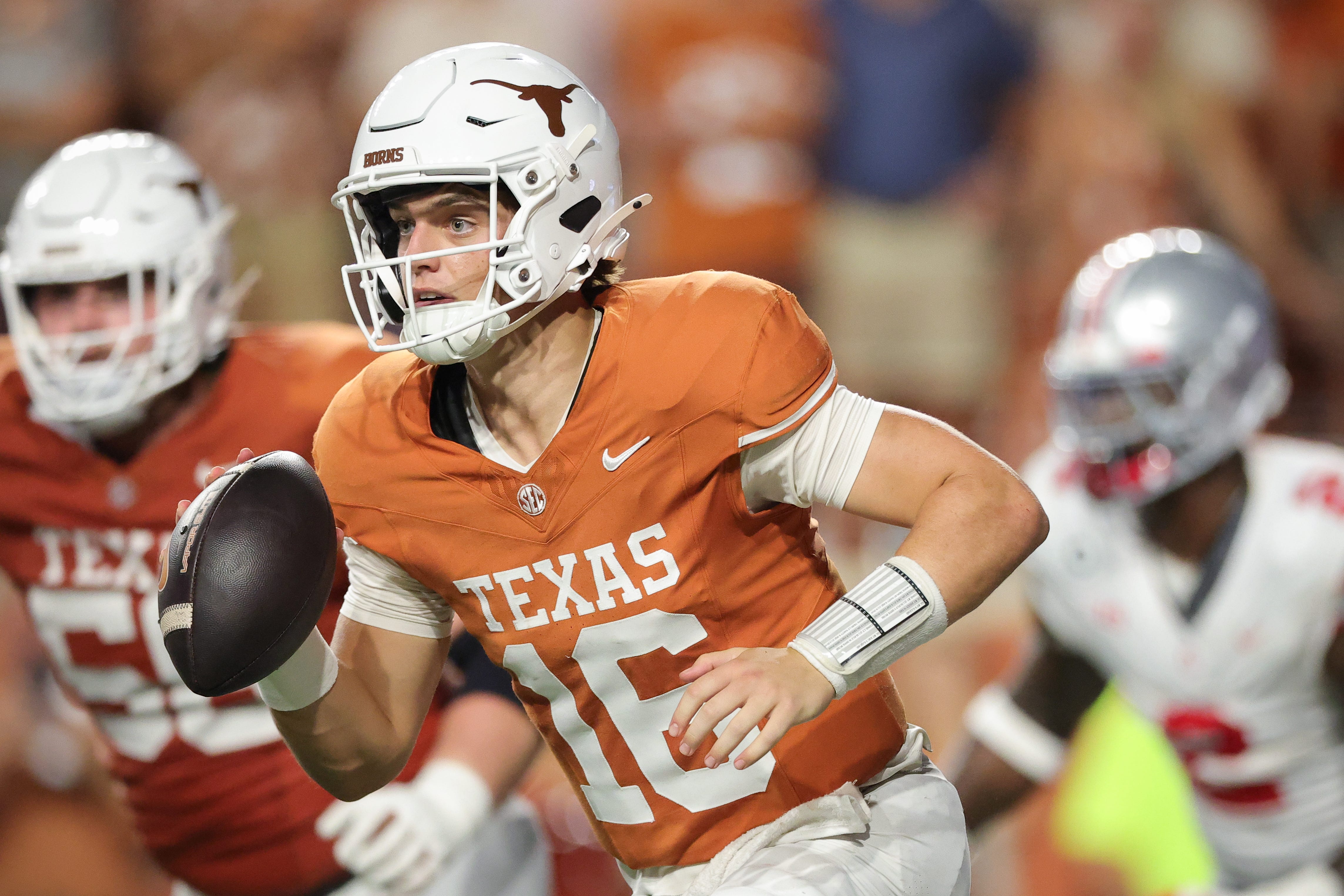 Arch Manning carries the ball in a Texas Longhorns game