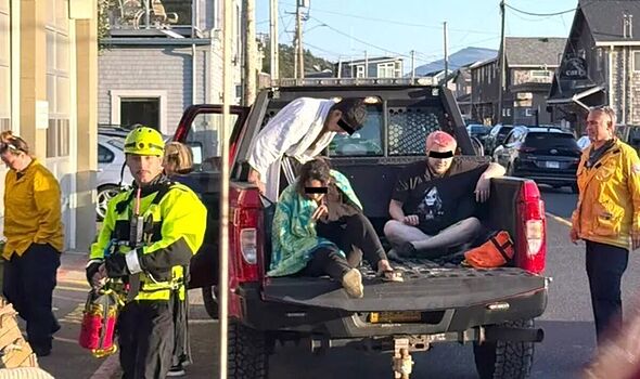 Tourists trapped on Oregon beach forced to make SOS sign out of ...