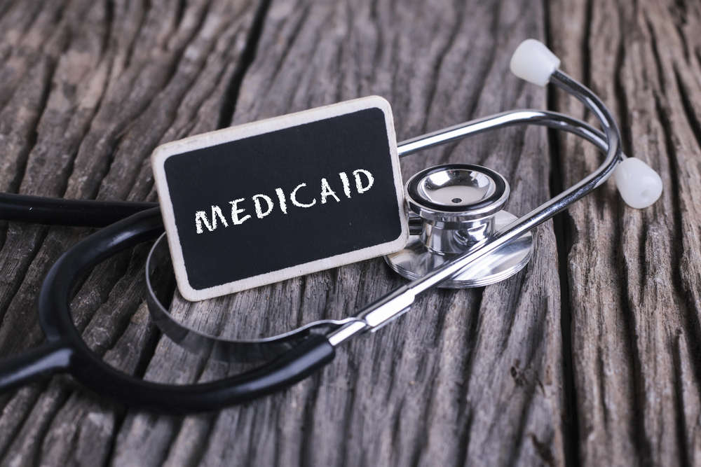 medicaid written on blackboard with stethoscope