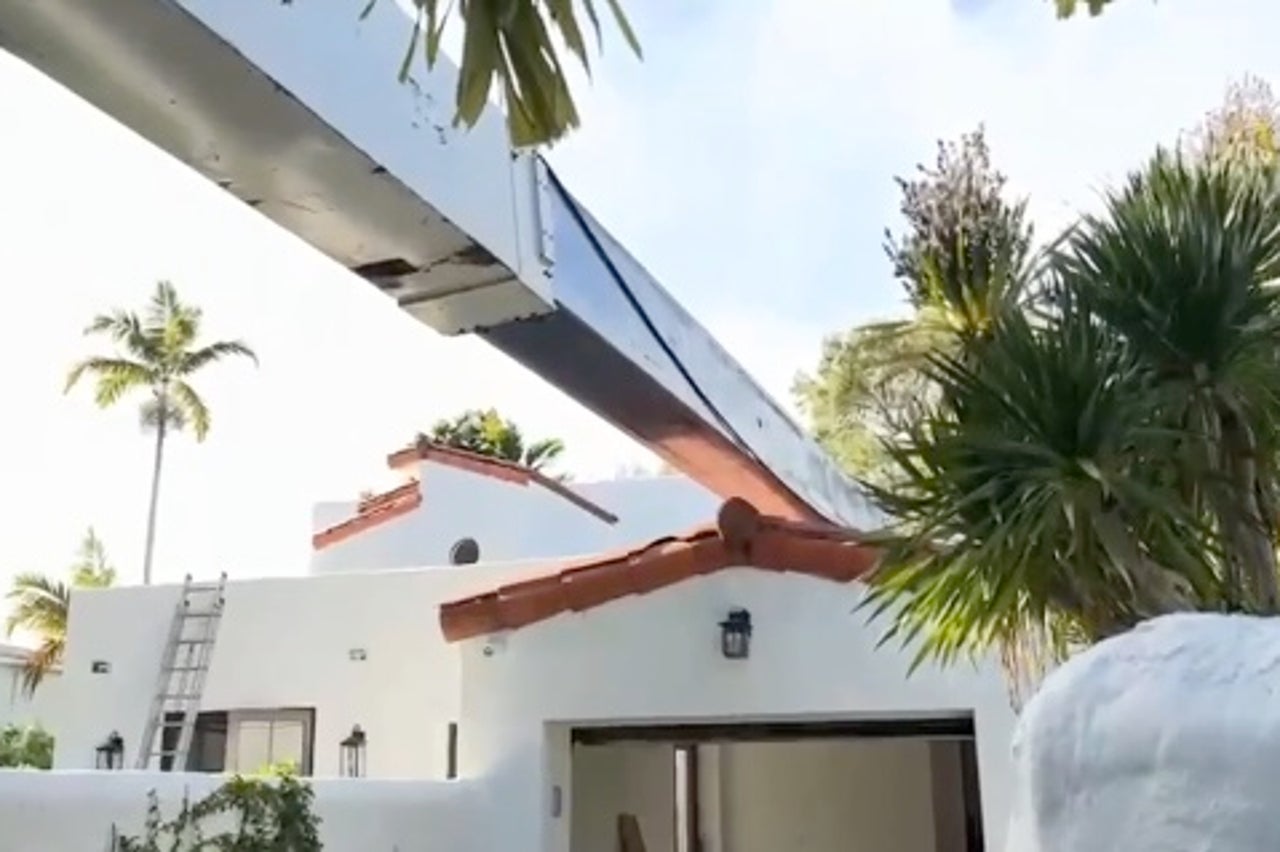 A second crane has toppled onto a home in Fort Lauderdale,Florida, while fire crews tried to use it to remove the first fallen crane (Fort Lauderdale Fire Rescue)