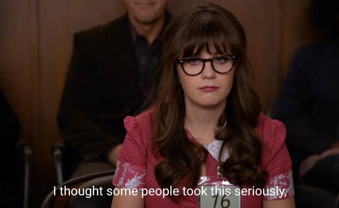 Person wearing glasses sits in an audience looking serious. Caption reads, "I thought some people took this seriously."