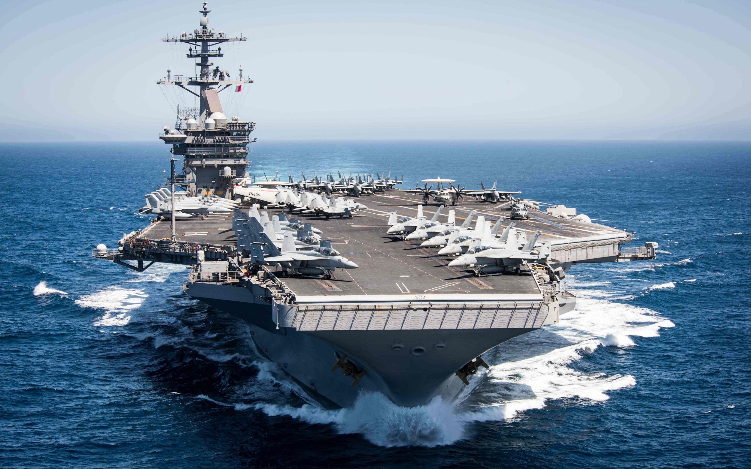 US deploys third carrier to Iran as Trump admits munitions shortage