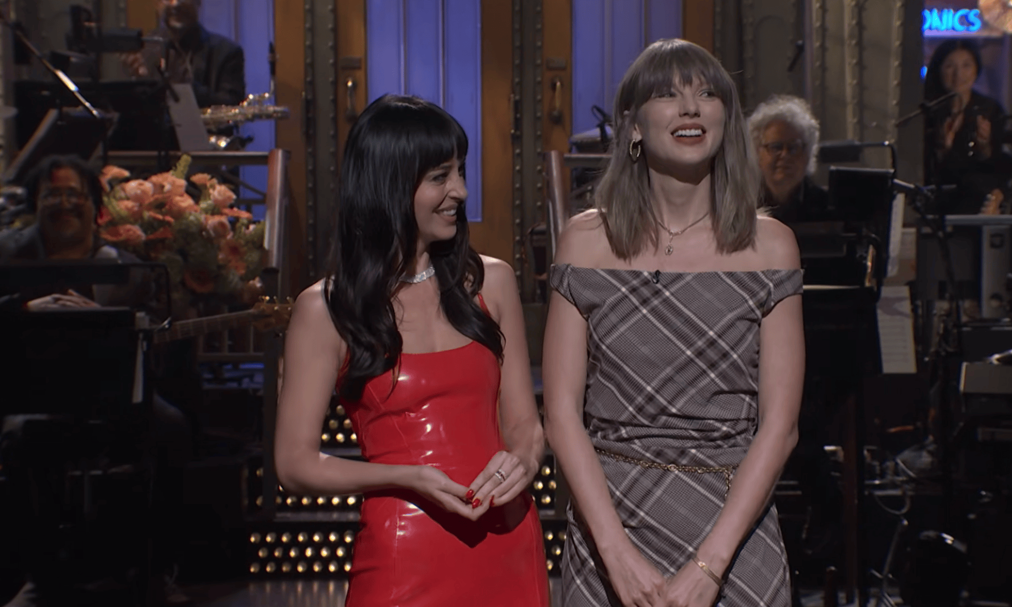 Taylor Swift Is Pretty in Plaid for Surprise ‘SNL’ Cameo With Host Dakota Johnson