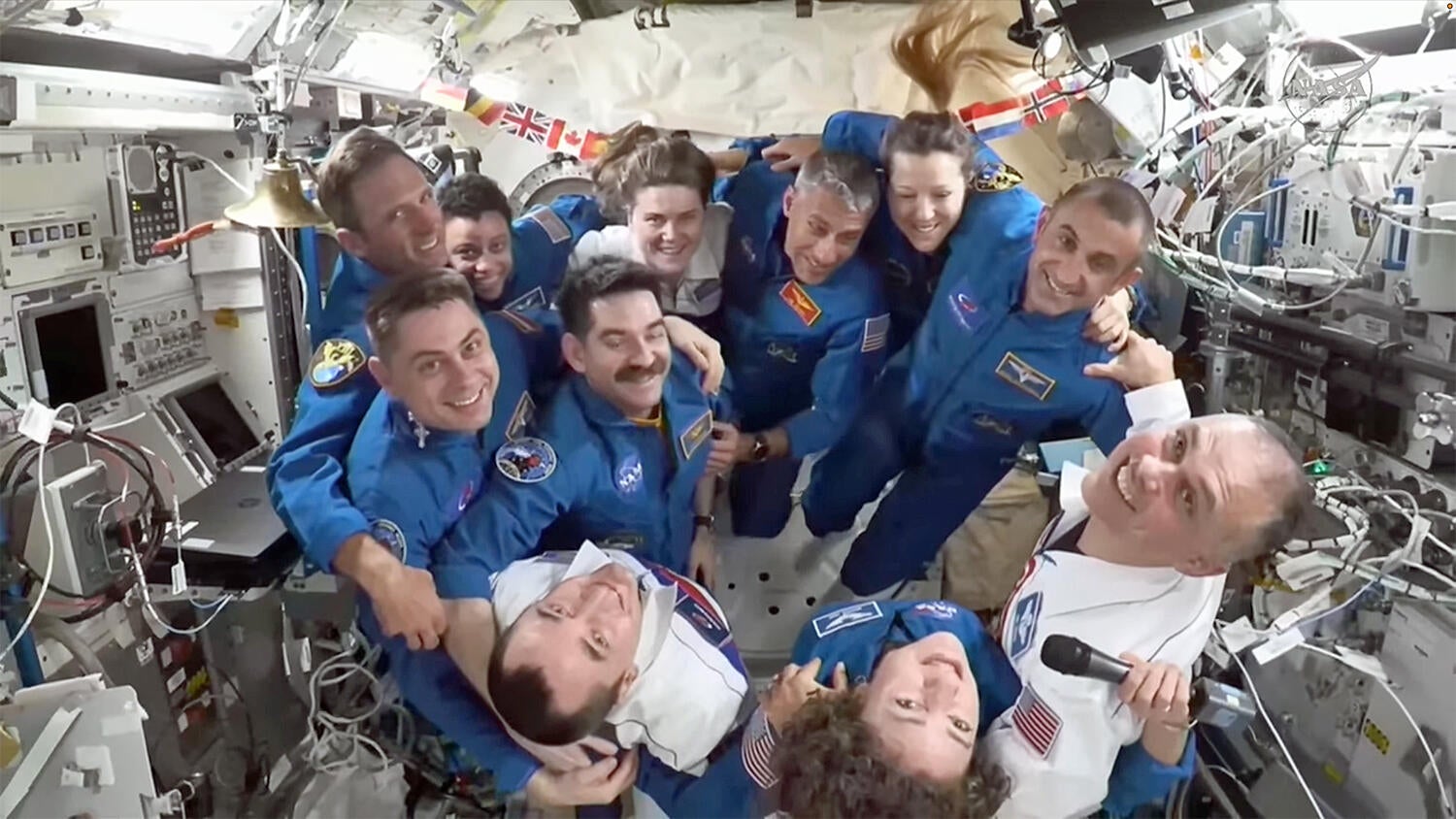 Space station crew returns home after eight-month mission