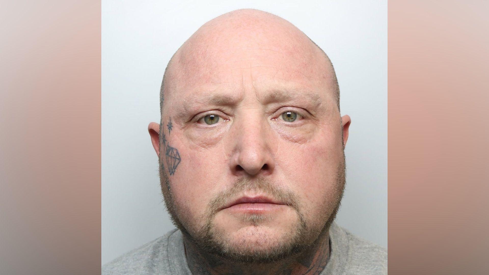 Man who kept wife's body in freezer jailed for life
