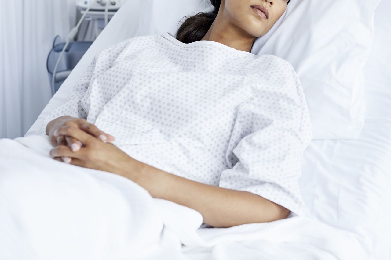 Woman lying in a hospital bedCredits: Getty