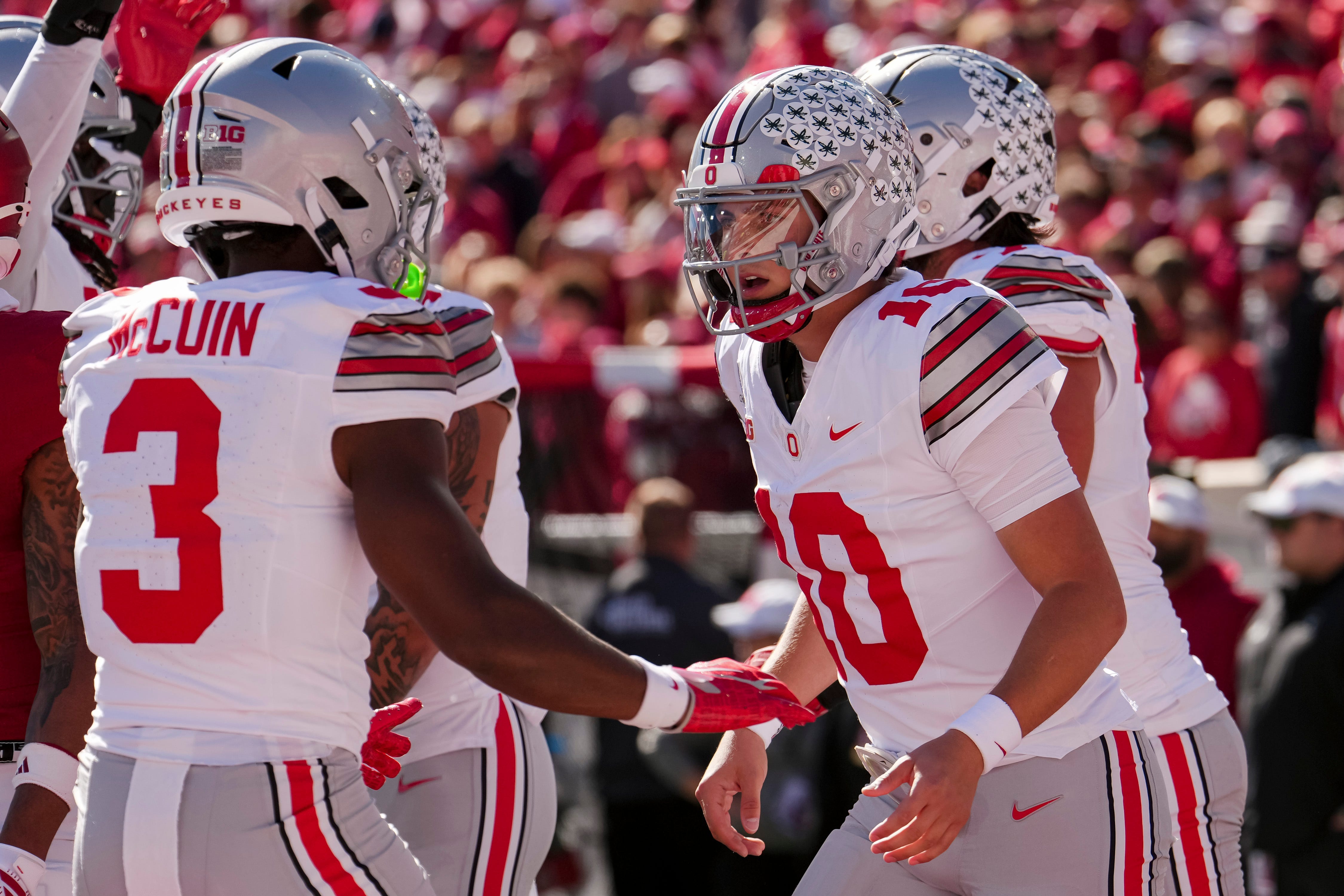 Ohio State Buckeyes quarterback Julian Sayin (10) celebrates with wide receiver Devin McCuin (3) during the NCAA football game at Memorial Stadium Stadium in Bloomington, Ind. on Oct. 17, 2026.