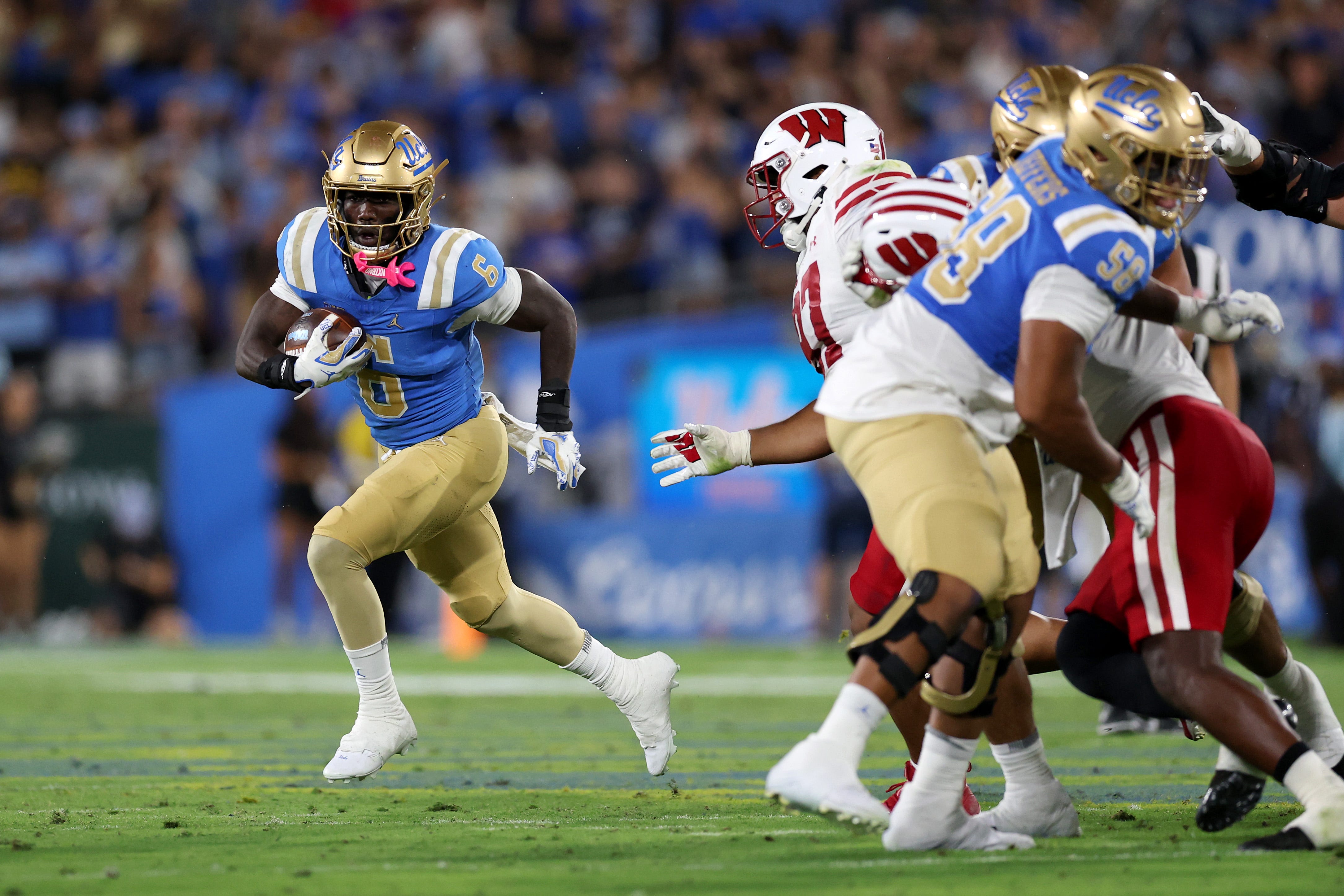 PASADENA, CALIFORNIA - OCTOBER 17: Anthony Woods #6 of the UCLA Bruins runs the ball against the Wisconsin Badgers during the third quarter at Rose Bowl Stadium on October 17, 2026 in Pasadena, California. (Photo by Luke Hales/Getty Images)