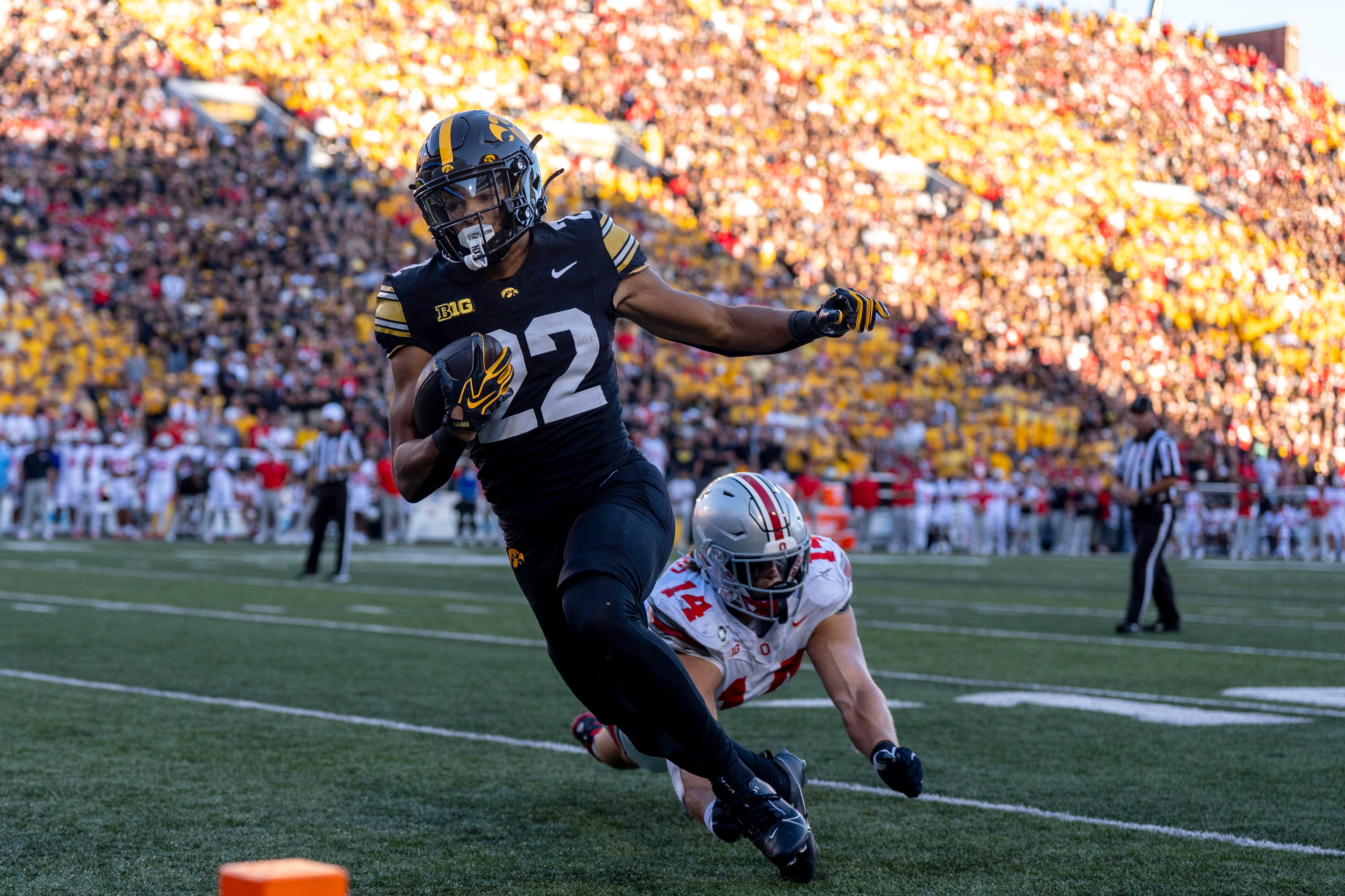 Iowa Hawkeyes running back Braeden Jackson (22) evades a tackle from Ohio State Buckeyes linebacker Christian Alliegro (14) before scoring a touchdown against the Ohio State Buckeyes during a Big Ten college football game Oct. 3, 2026 at Kinnick Stadium in Iowa City, Iowa.