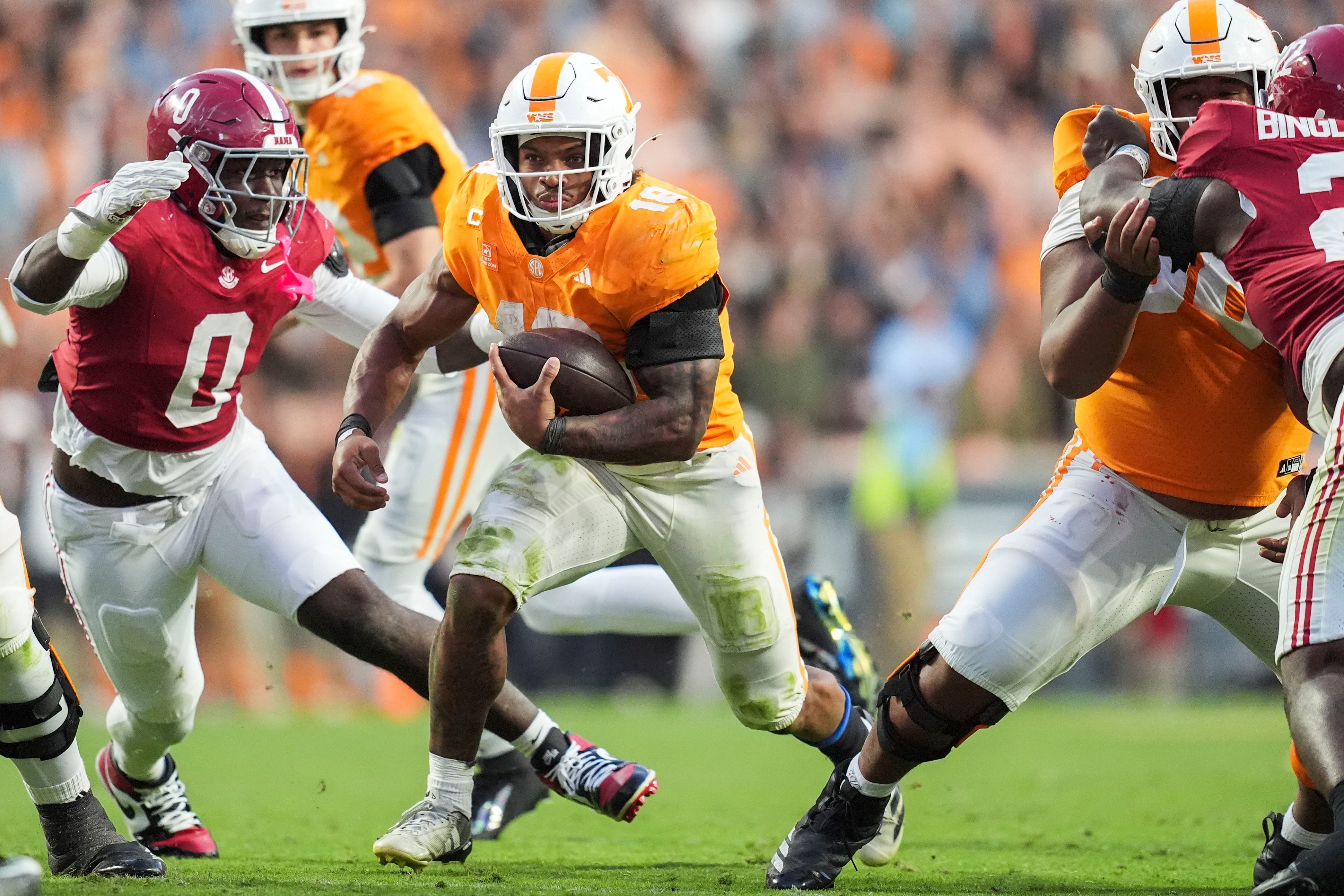Tennessee running back DeSean Bishop (18) finds a hole during a football game between Tennessee and Alabama at Neyland Stadium in Knoxville, Tenn., on Oct. 17, 2026.