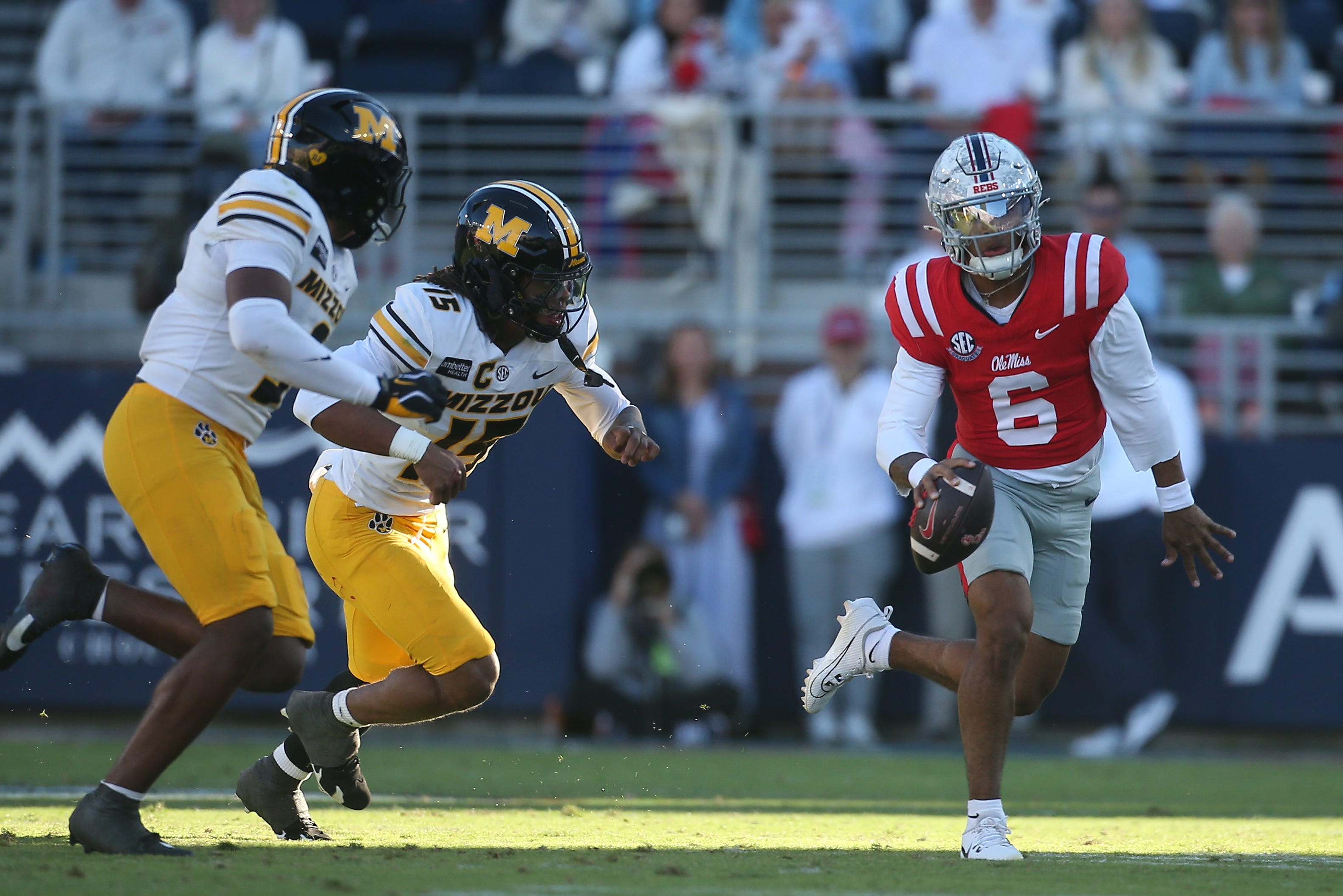 Oct 17, 2026; Oxford, Mississippi, USA;  Missouri Tigers safety Santana Banner (15) forces a fumble by Mississippi Rebels quarterback Trinidad Chambliss (6) during the second half at Vaught-Hemingway Stadium.  Mandatory Credit: Petre Thomas-Imagn Images
