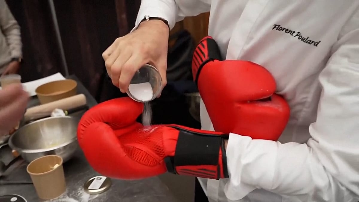 Professional chefs coach amateur cooks in French boxing glove cooking competition