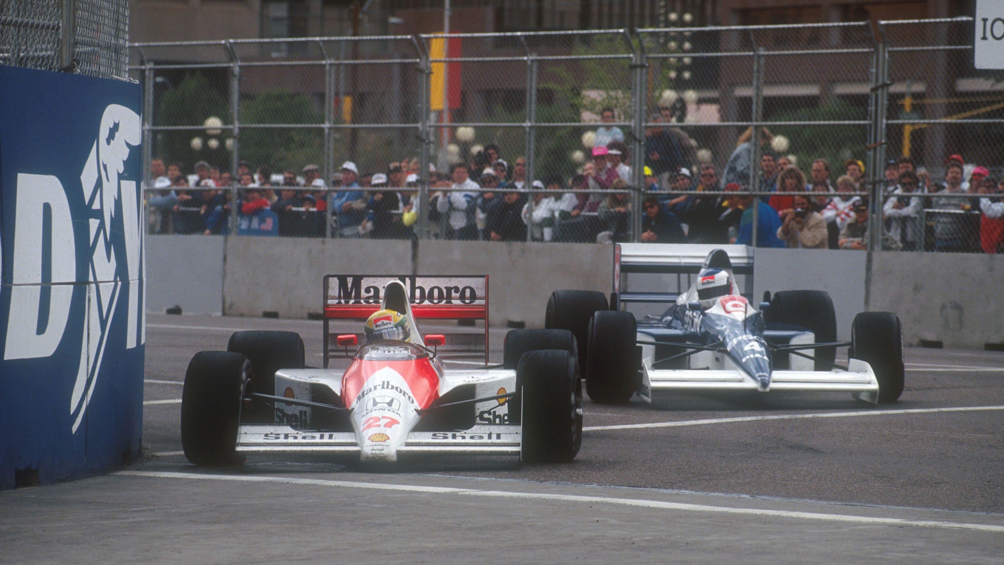 McLaren's Ayrton Senna turns into a right-hand corner just ahead of the Tyrrell of Jean Alesi during the 1990 United States Grand Prix in Phoenix 
