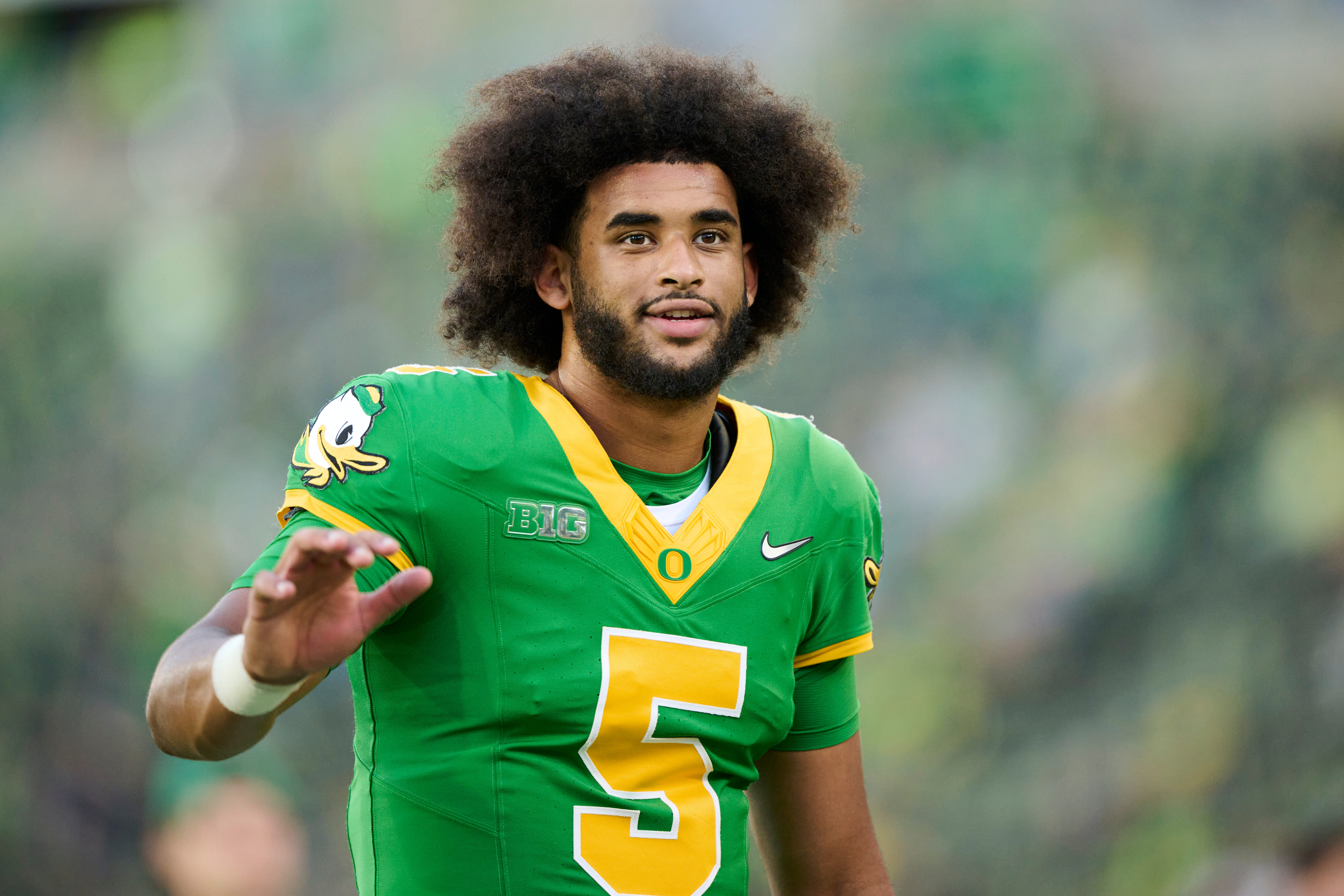 Sep 18, 2026; Eugene, Oregon, USA; Oregon Ducks quarterback Dante Moore (5) waves to a fan before a game against the Portland State Vikings at Autzen Stadium. Mandatory Credit: Troy Wayrynen-Imagn Images
