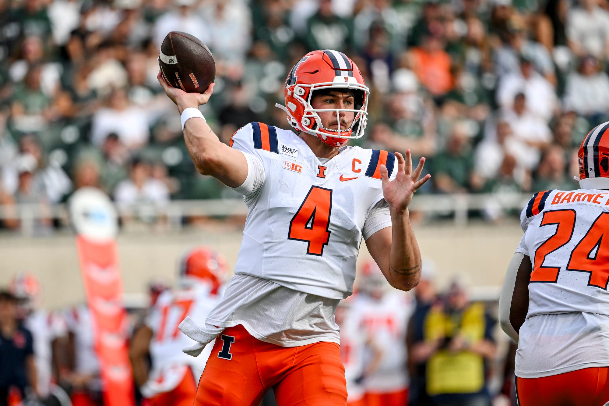 Illinois’ Katin Houser throws a pass against Michigan State during the first quarter on Saturday, Oct. 10, 2026, at Spartan Stadium in East Lansing.