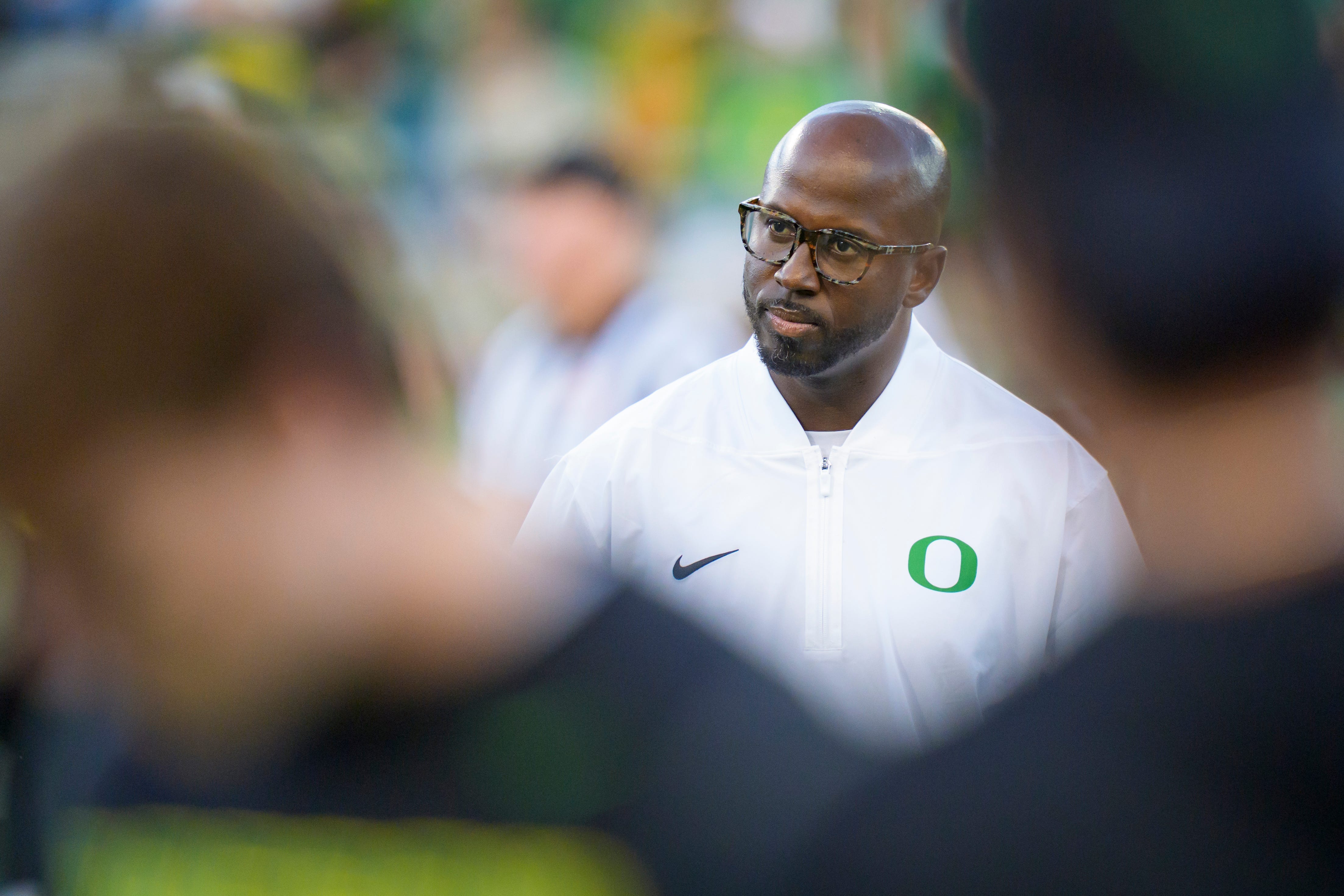 Oregon defensive coordinator Chris Hampton walks the field before the game as the Oregon Ducks host the Portland State Vikings on Sept. 18, 2026, at Autzen Stadium in Eugene, Oregon.