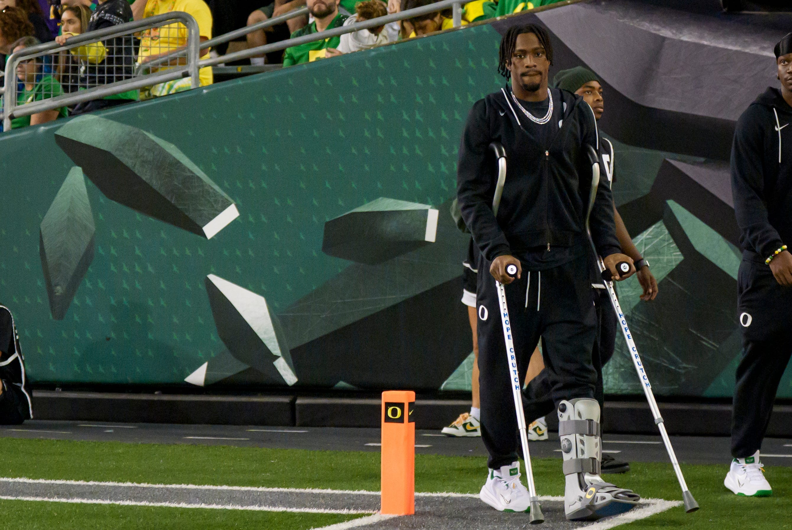Oregon wide receiver Jeremiah McClellan walks on the field in a boot as the Oregon Ducks host the Portland State Vikings on Sept. 18, 2026, at Autzen Stadium in Eugene, Oregon.
