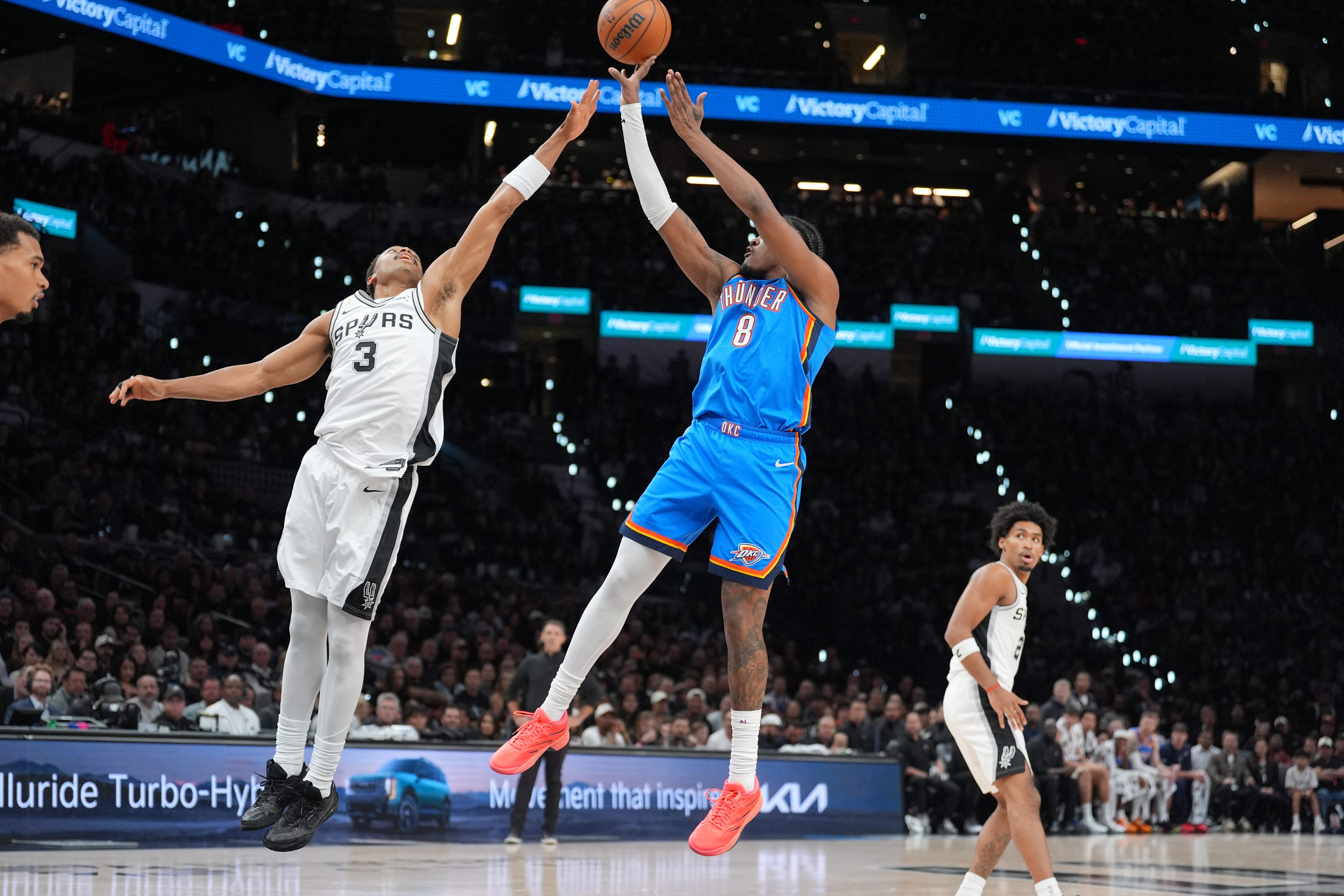 Oct 20, 2026; San Antonio, Texas, USA;  Oklahoma City Thunder guard Jalen Williams (8) shoots over San Antonio Spurs forward Keldon Johnson (3) in the first half at Frost Bank Center.  Mandatory Credit: Daniel Dunn-Imagn Images
