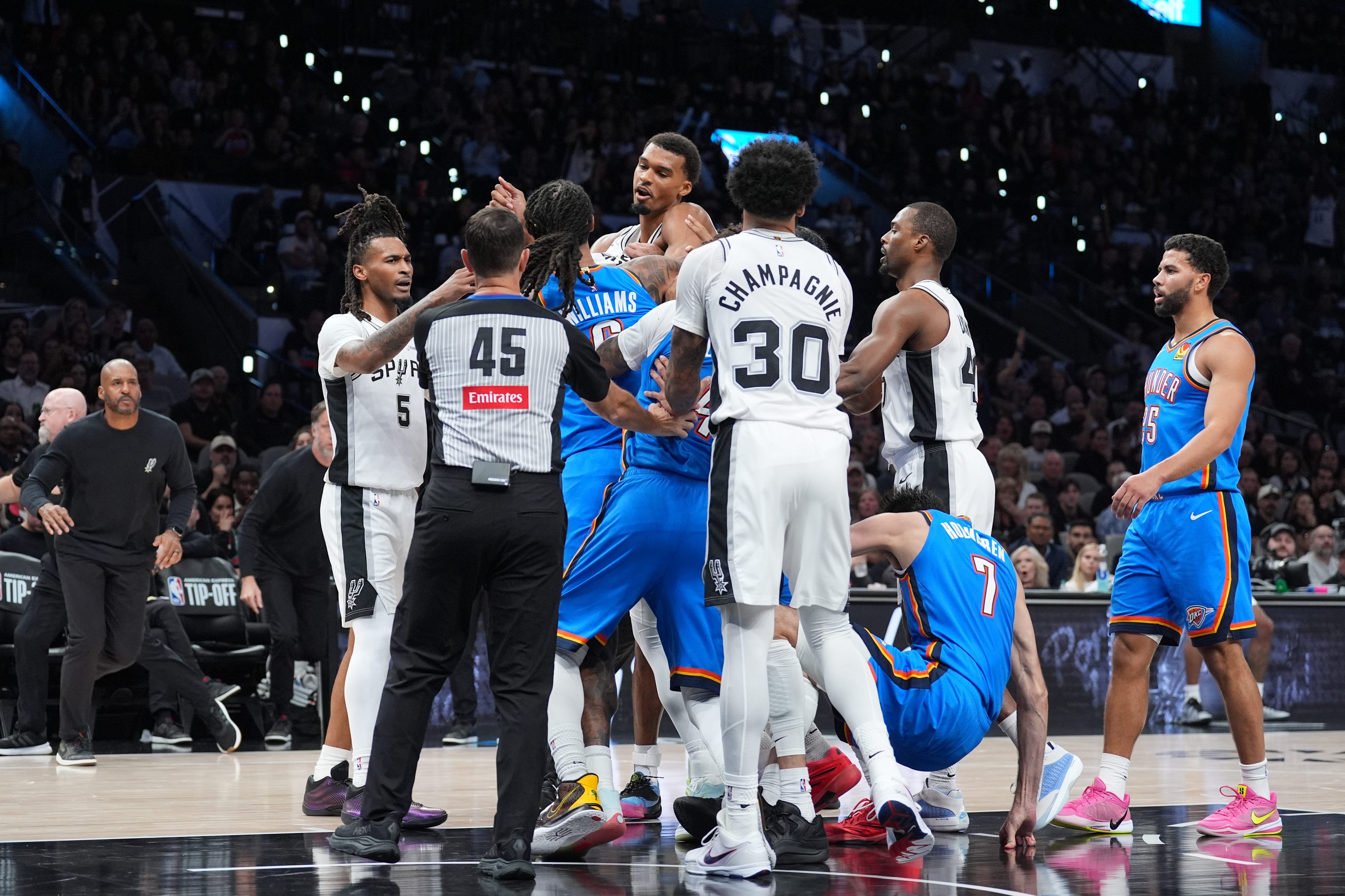 Oct 20, 2026; San Antonio, Texas, USA;  Oklahoma City Thunder forward Jaylin Williams (6) gets in an altercation with San Antonio Spurs forward Victor Wembanyama (1) in the first half at Frost Bank Center.  Mandatory Credit: Daniel Dunn-Imagn Images