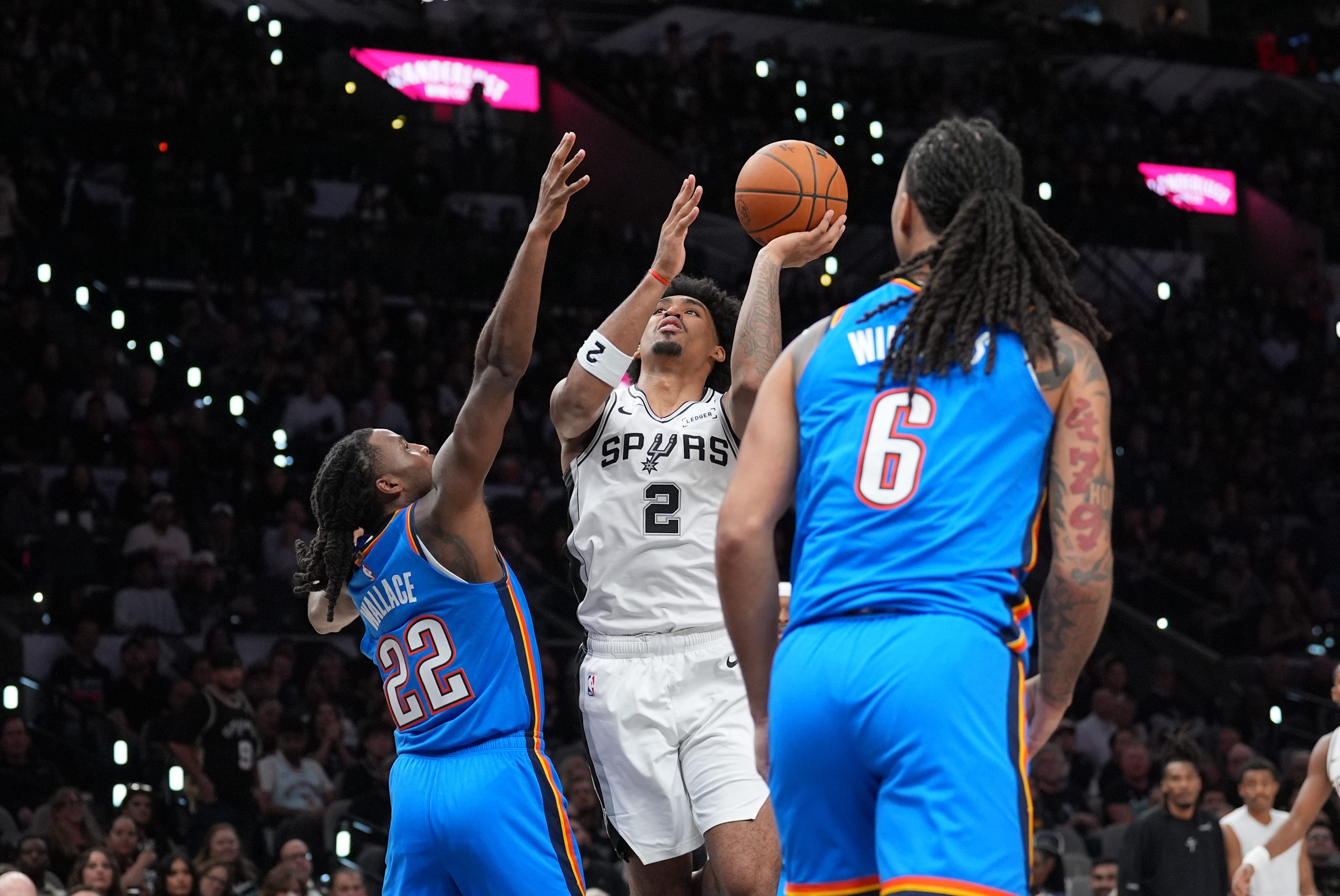 Oct 20, 2026; San Antonio, Texas, USA;  San Antonio Spurs guard Dylan Harper (2) shoots against Oklahoma City Thunder guard Cason Wallace (22) in the second half at Frost Bank Center.  Mandatory Credit: Daniel Dunn-Imagn Images